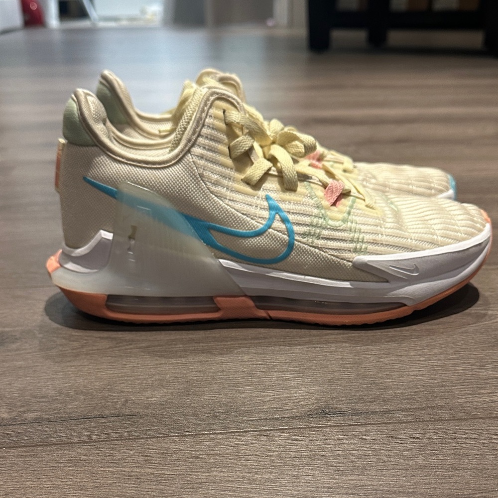 Nike Cream and Blue Sneakers with Orange Accents